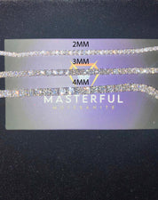 Display card with 'Masterful' moissanite strands of different widths on a dark background.