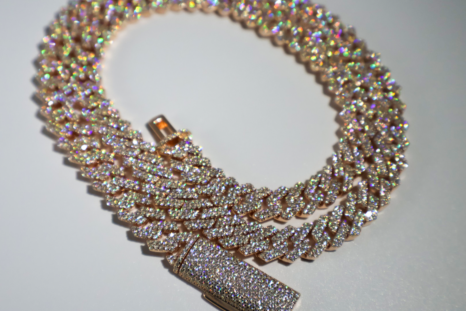 Rose Gold Moissanite Cuban Link Chain 925 Sterling Silver showing brilliant sparkle and warm rose gold finish